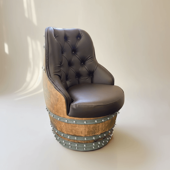 Tufted Vintage Barrel Chair with handcrafted design and reclaimed wood, exuding farmhouse elegance and luxury upholstery.