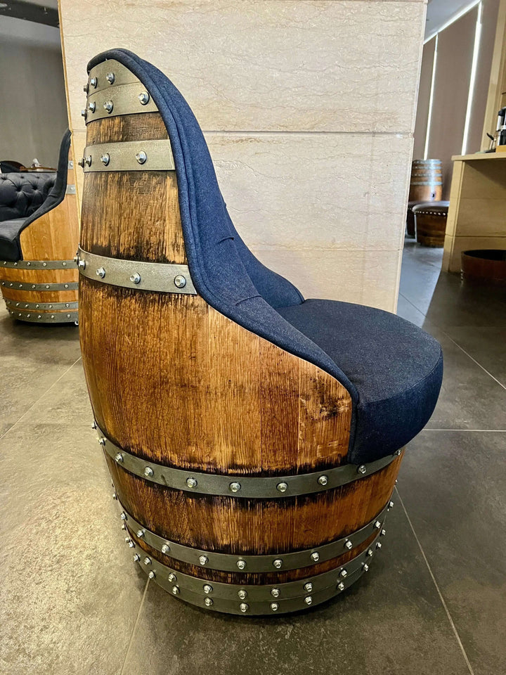 Tufted Vintage Barrel Chair with handcrafted wooden structure and blue upholstery, showcasing farmhouse elegance and unique design.