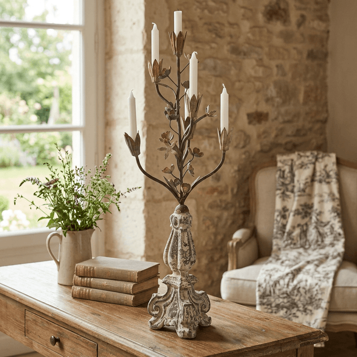 Tulip Bouquet Candelabra with taper candles styled on a wooden console table beside books in a French country room