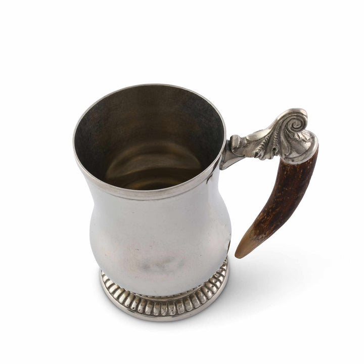 Silver mug with a decorative handle on a white background