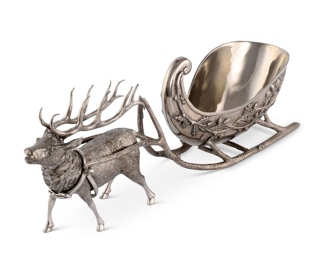 Decorative silver reindeer with sleigh on a white background