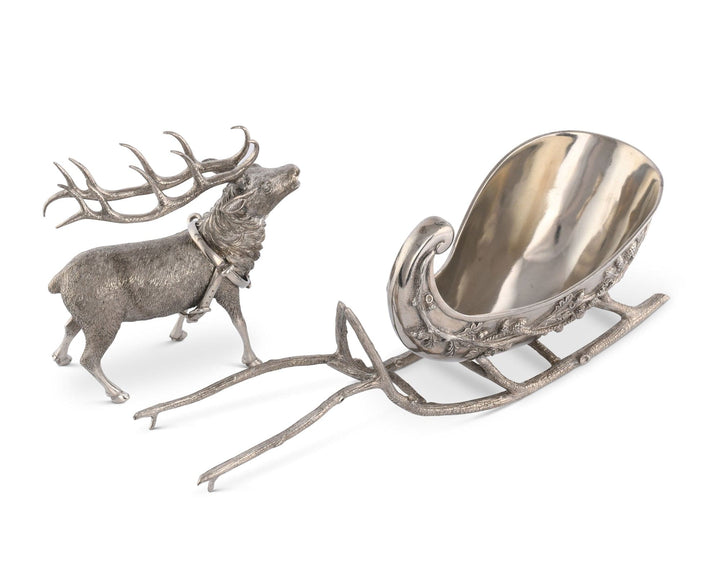 Decorative silver reindeer with sleigh on a white background