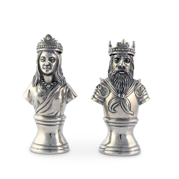 Two silver salt and pepper shakers busts, one of a king and one of a queen, on a white background.