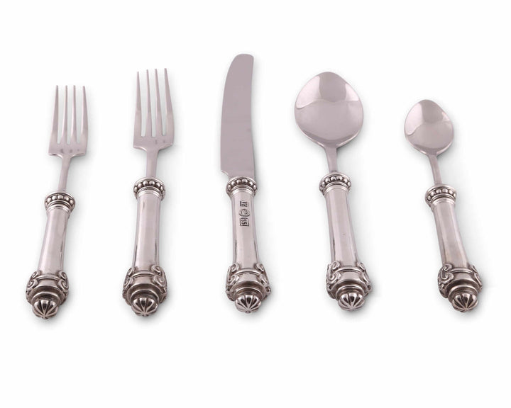 Set of silver flatware including forks and spoons on a white background