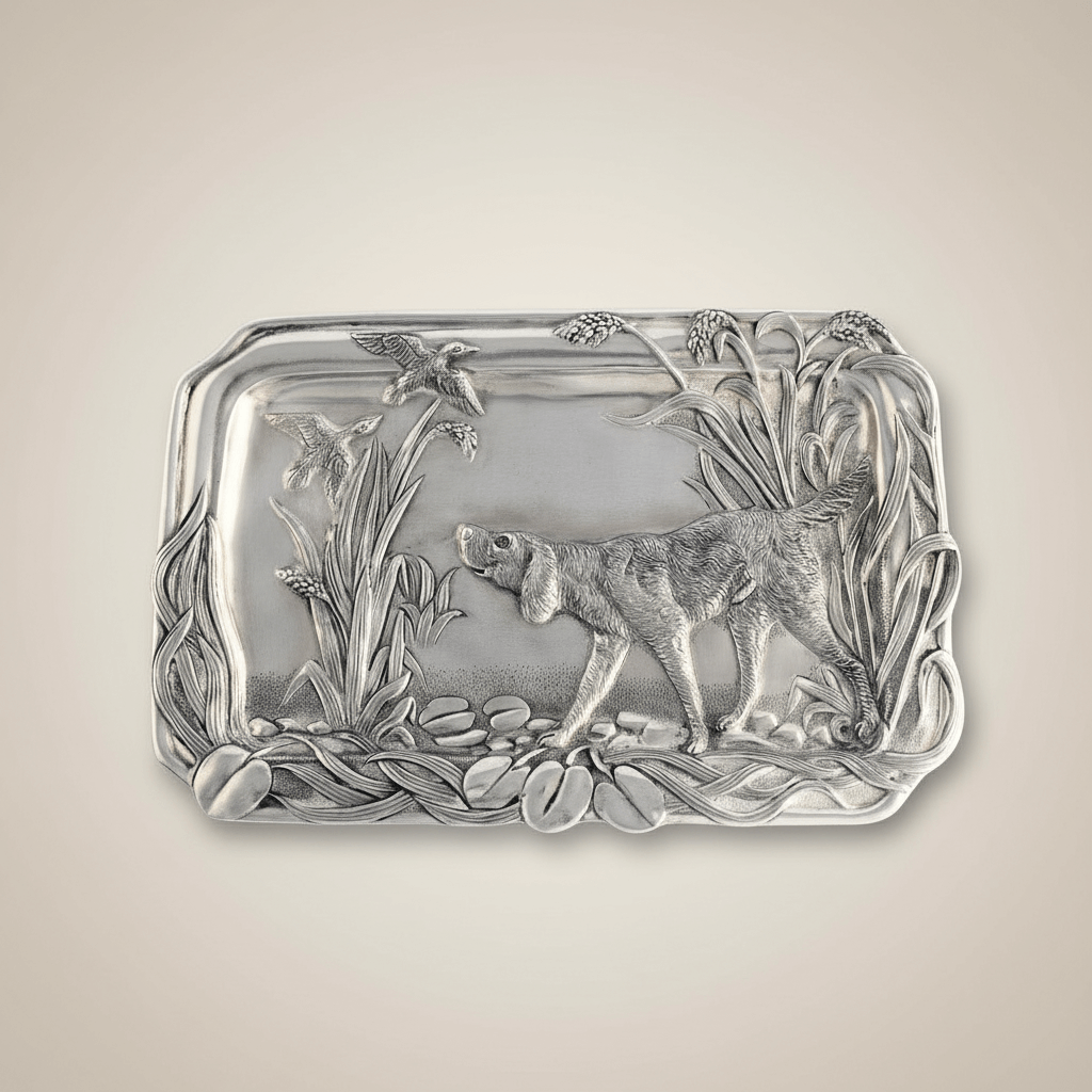 Decorative silver tray with a dog design on a beige background