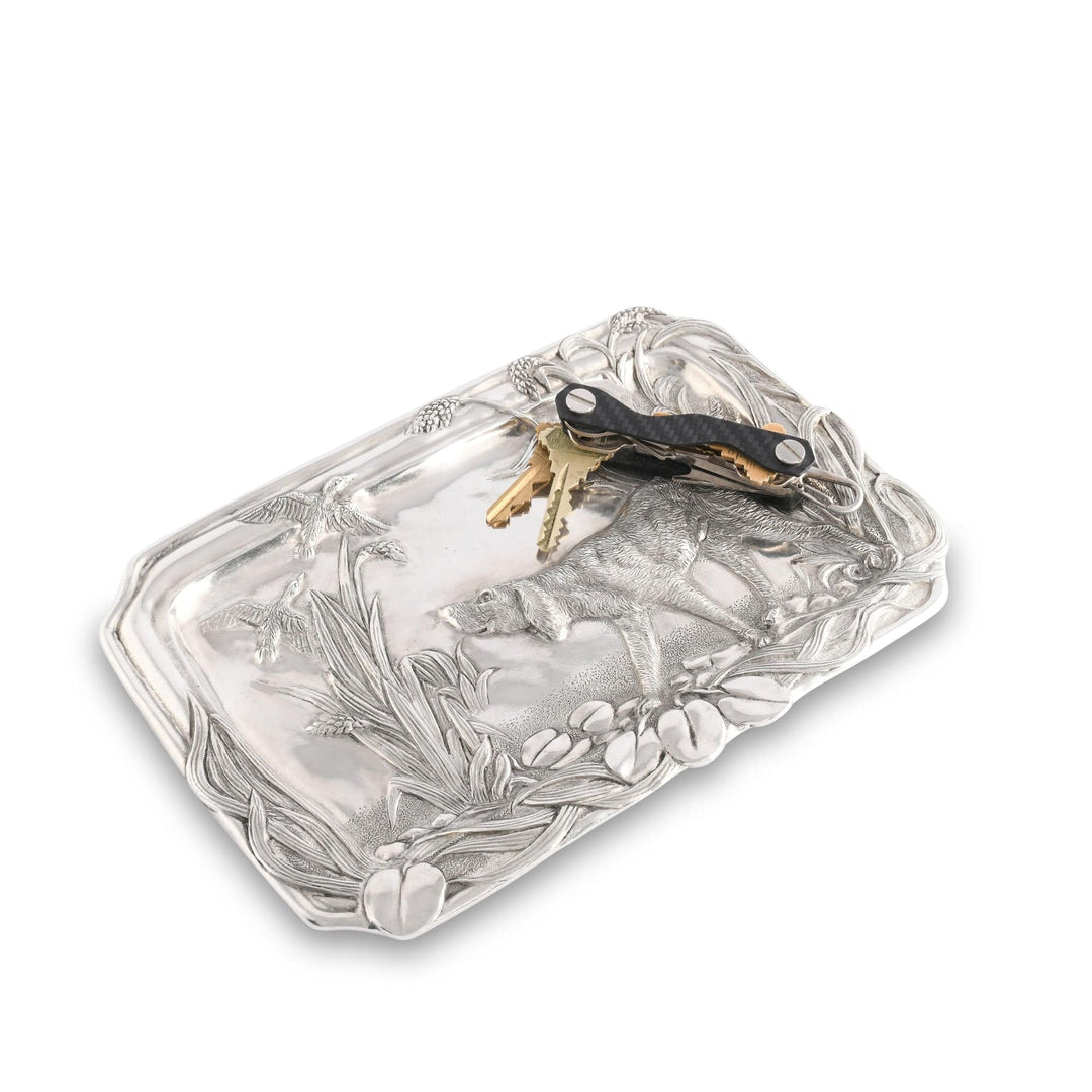 Decorative silver tray with floral patterns on a white background