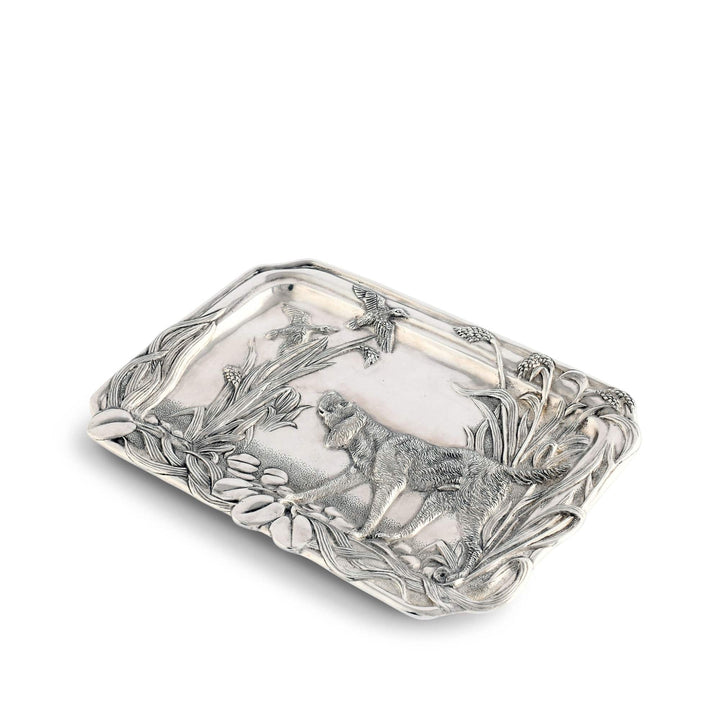 Silver decorative tray with intricate designs on a white background