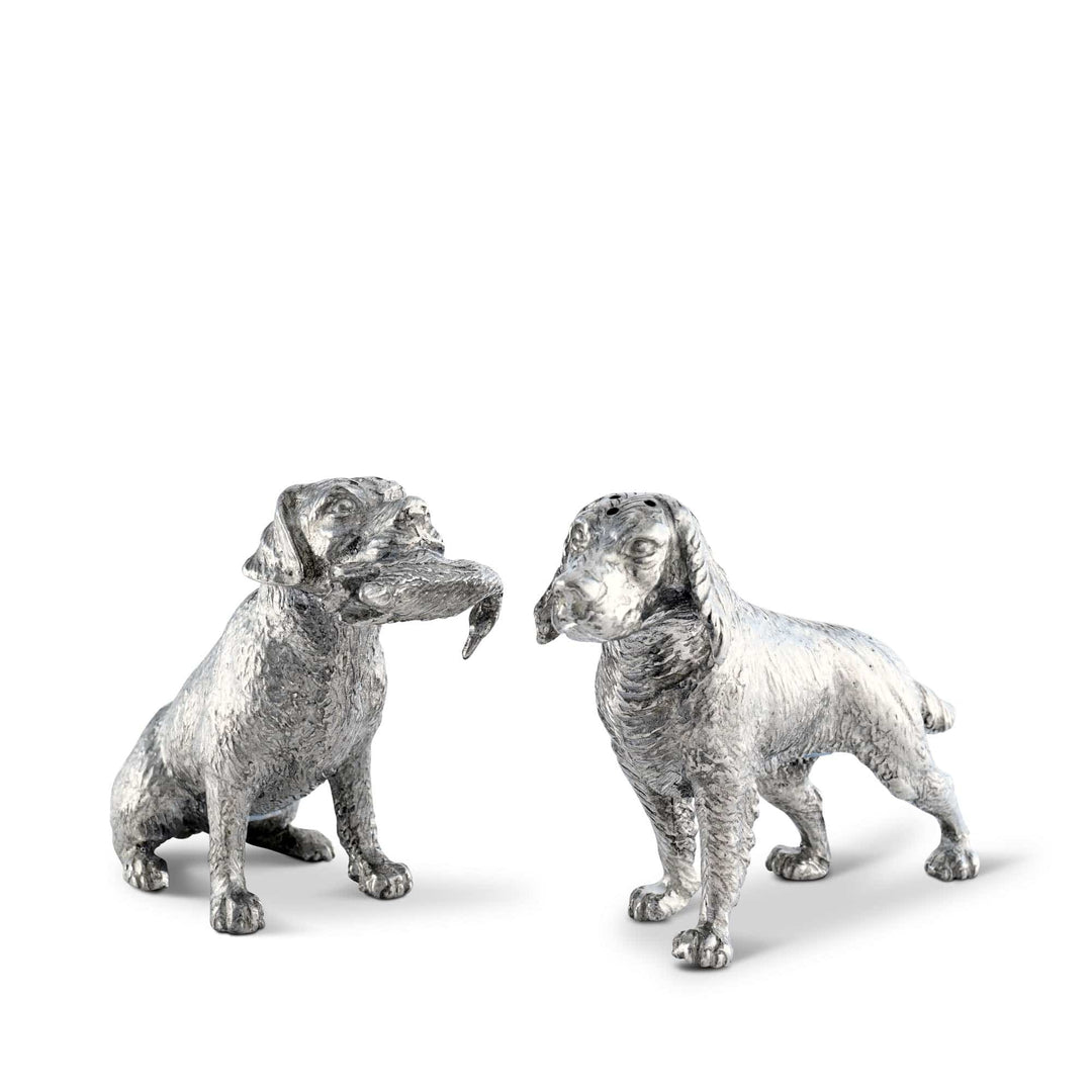 Two silver dog salt and pepper shaker figurines on a white background