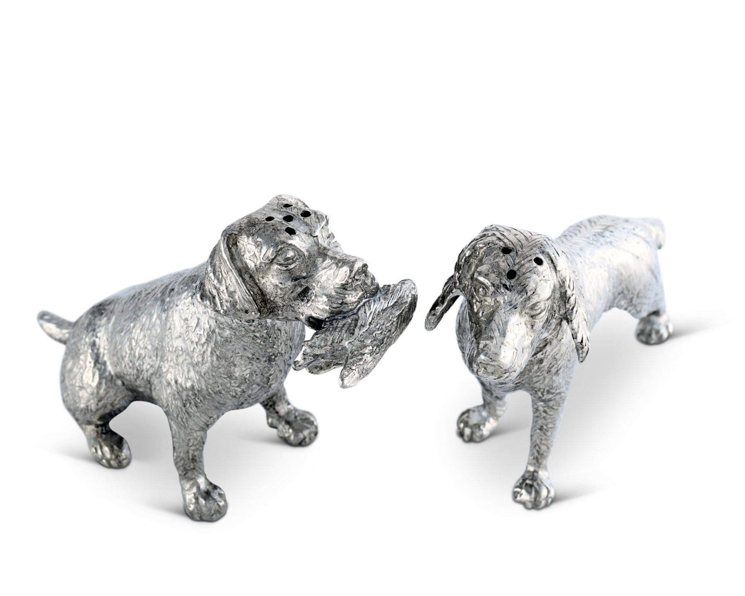 Two silver dog salt and pepper shaker figurines on a white background