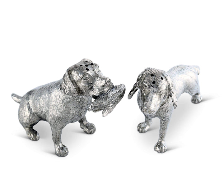 Two silver dog salt and pepper shaker figurines on a white background
