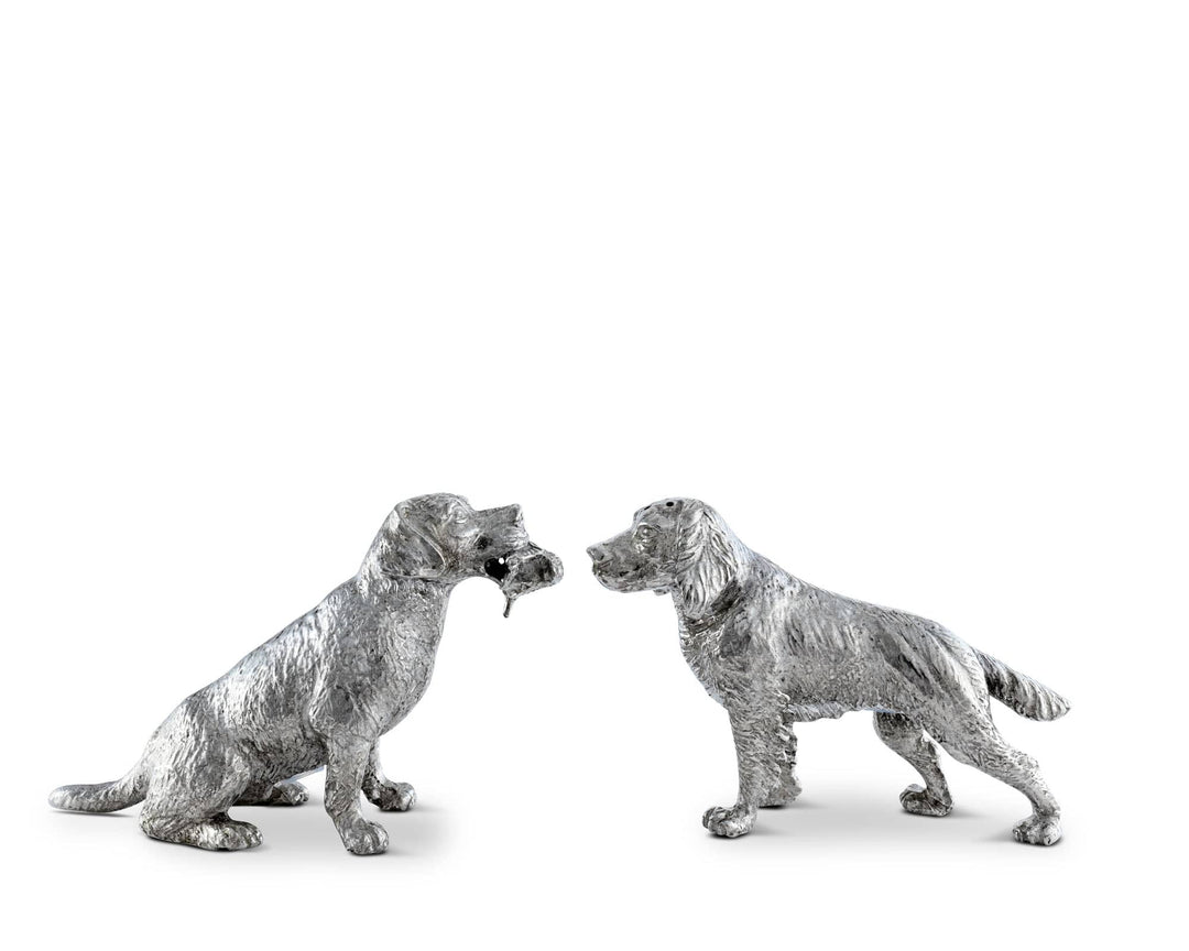 Two silver dog salt and pepper shaker figurines on a white background