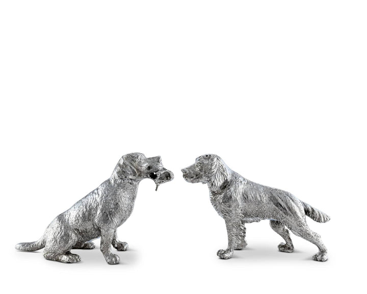 Two silver dog salt and pepper shaker figurines on a white background