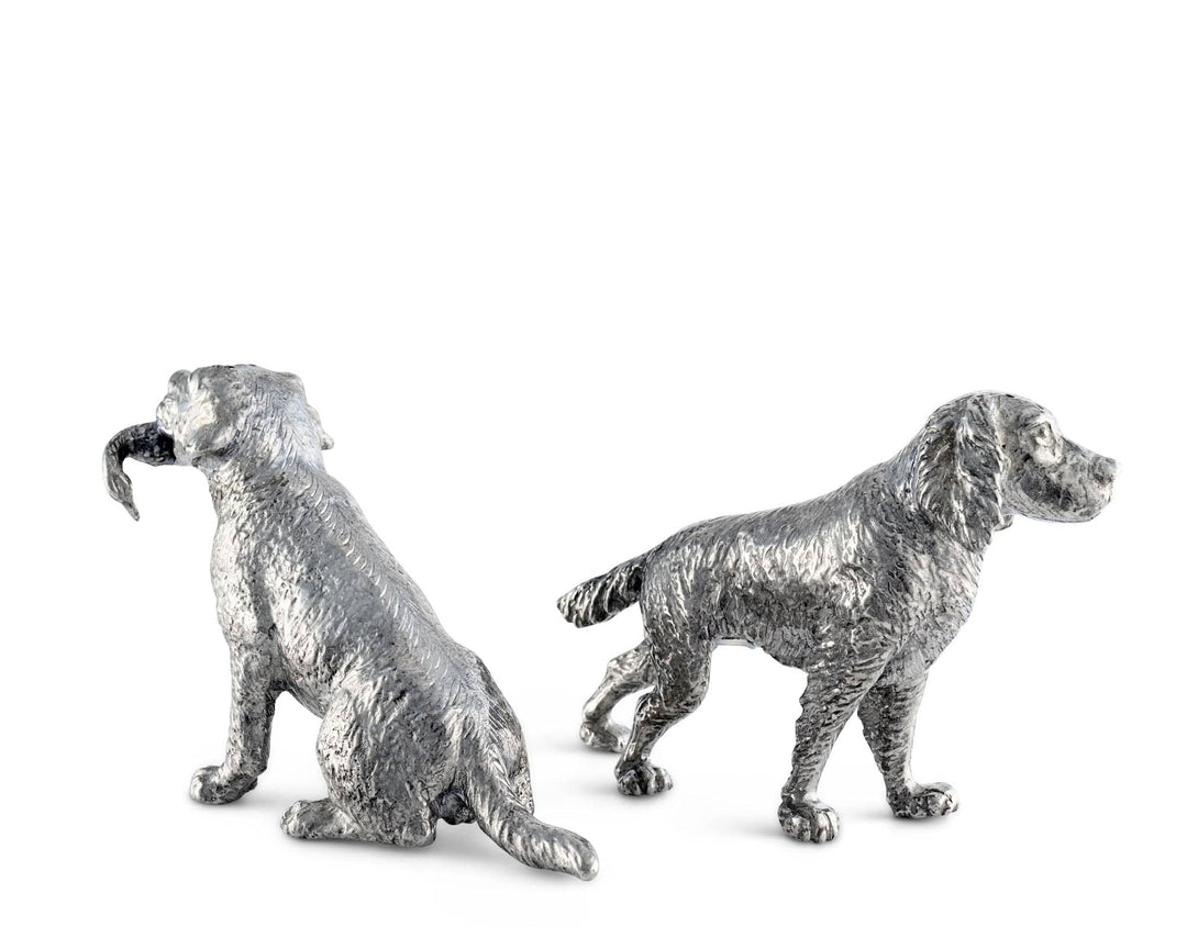 Two silver dog salt and pepper shaker figurines on a white background