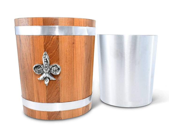 Wooden ice bucket with silver band and fleur-de-lis emblem next to a silver insert on a white background
