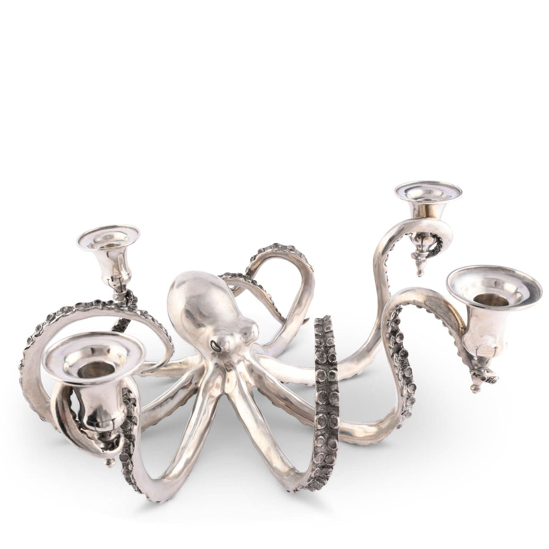 Silver octopus-shaped candle holder on a white background