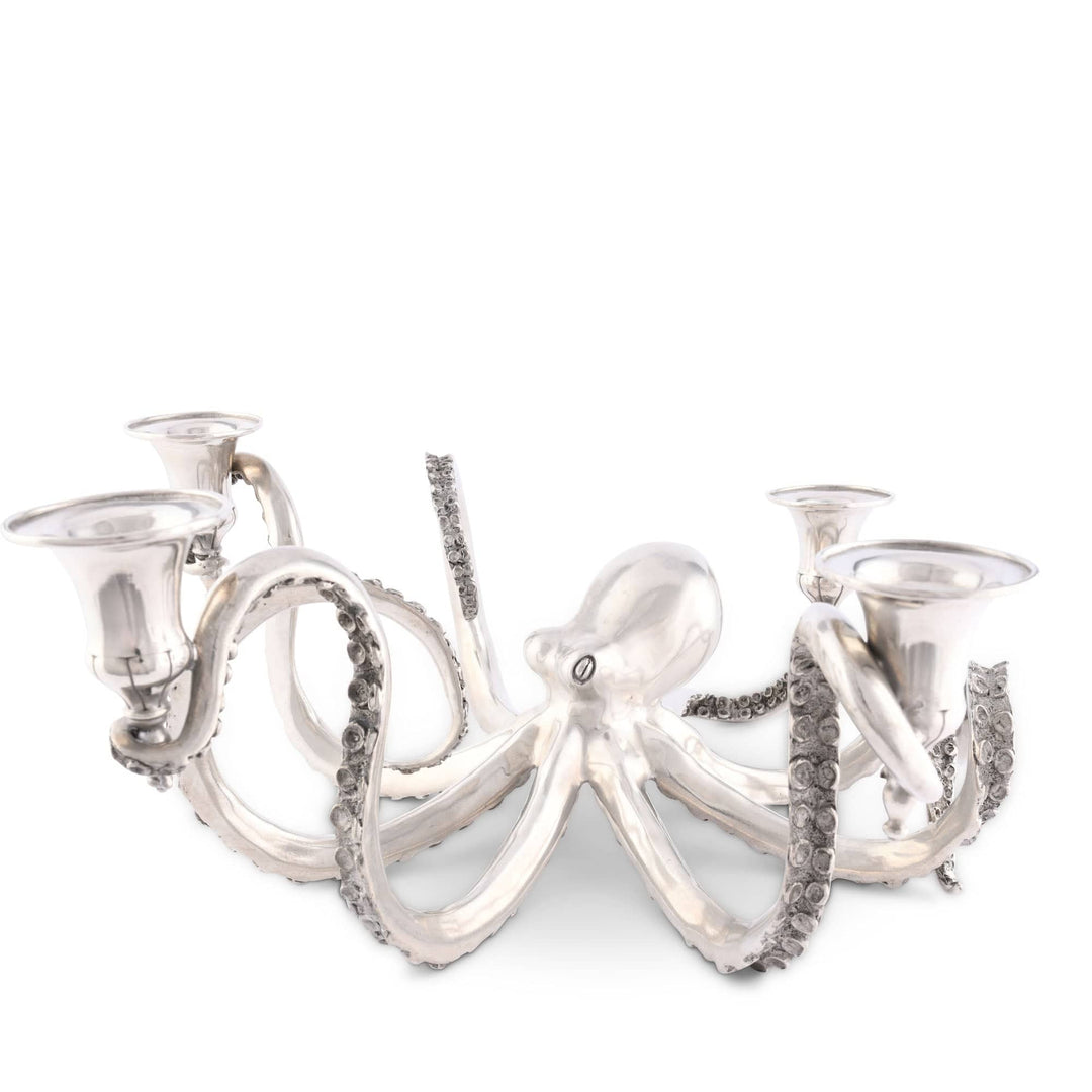 Silver octopus-shaped candle holder on a white background