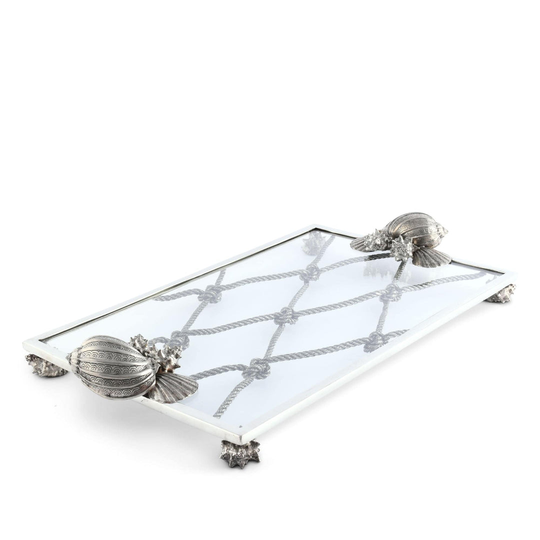 Decorative tray with shell designs on a white background