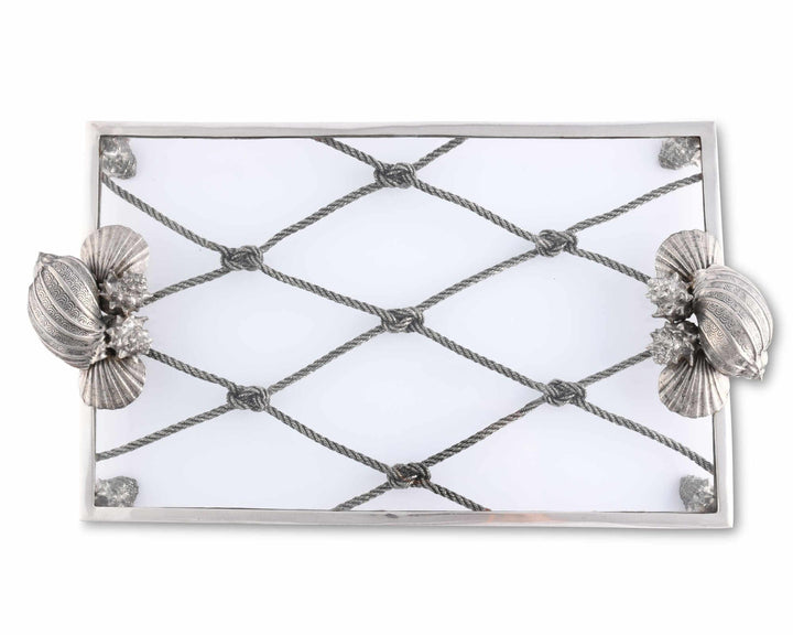 Decorative mirror with shell designs on a white background