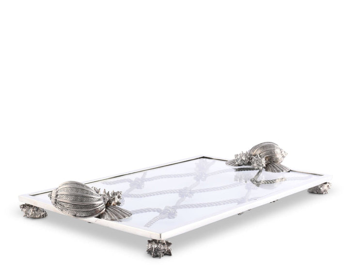 Decorative tray with shell designs on a white background