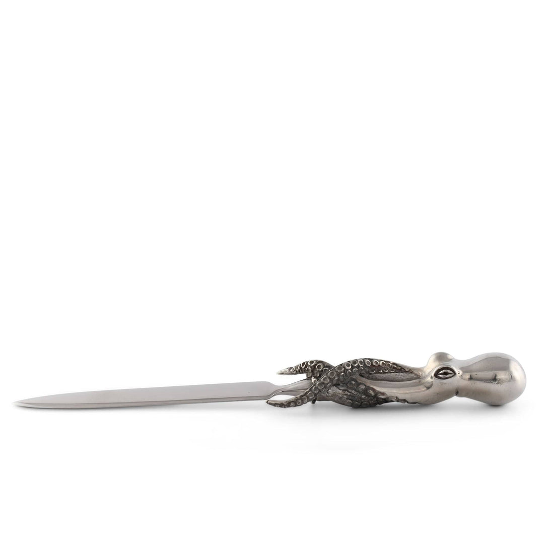 Metallic letter opener shaped like an octopus on a white background
