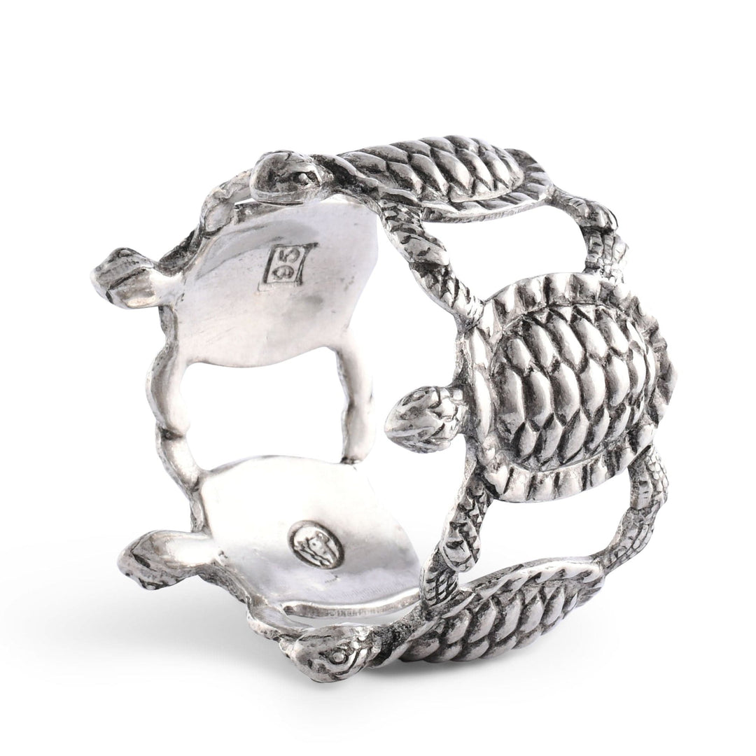 Silver turtle-shaped napkin ring on a white background