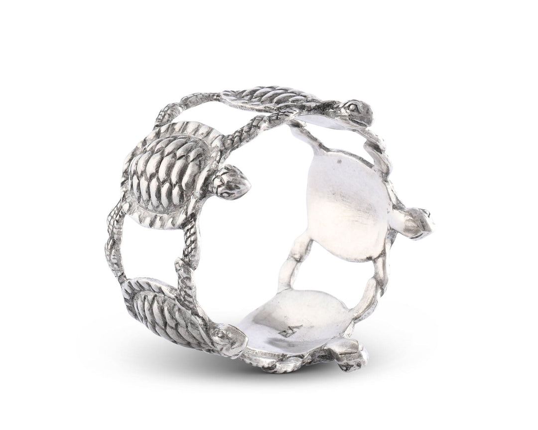 Silver napkin ring with turtle design on a white background