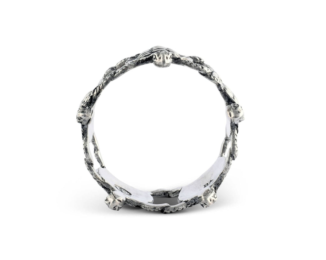 Silver napkin ring with a textured band on a white background