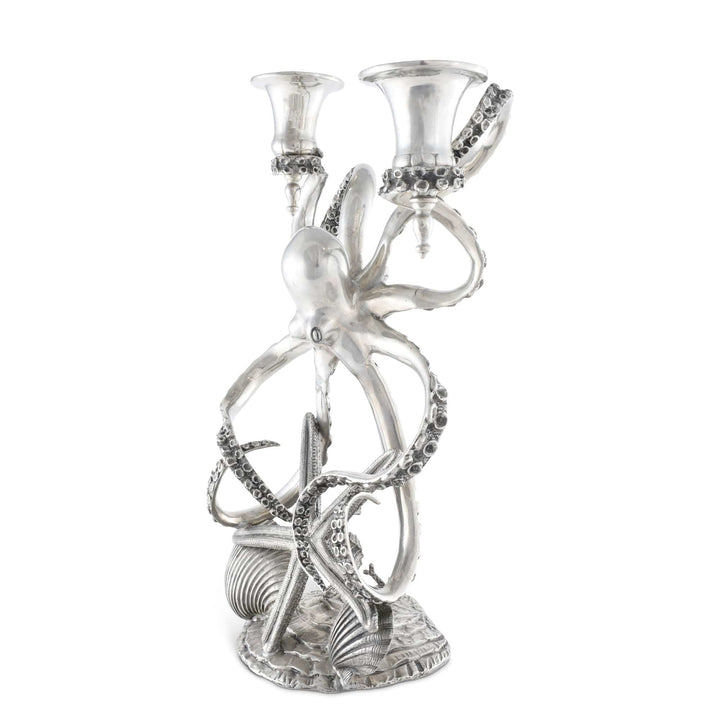 Silver octopus candelabra with decorative elements on a white background