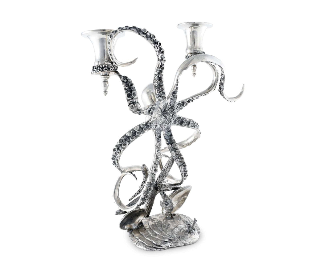 Silver octopus-shaped candle holder on a white background