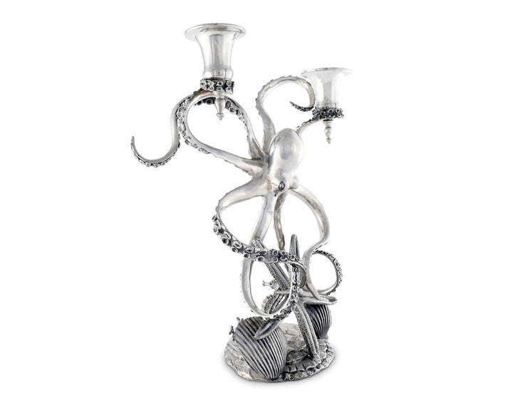 Silver octopus candle holder with two candles on a white background