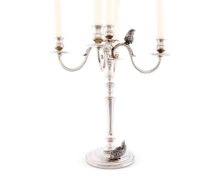 Silver candelabrum with candles on a white background