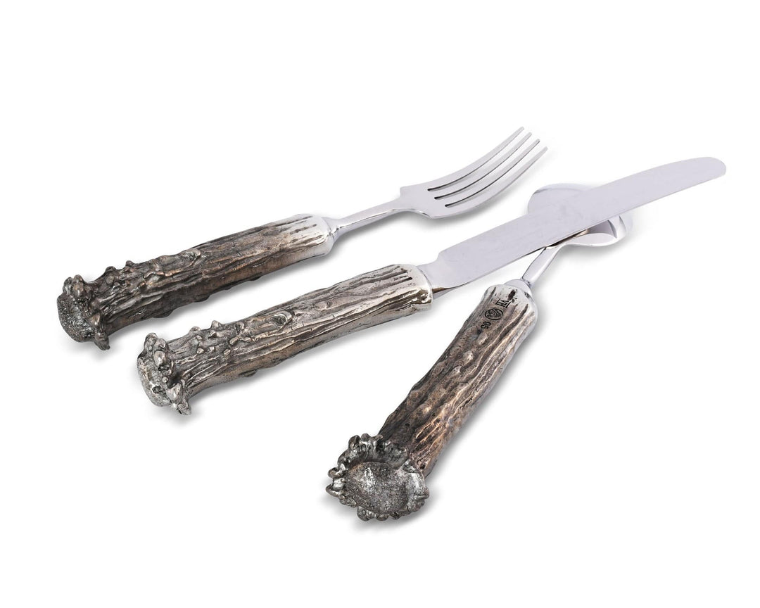 Set of cutlery with antler handles on a white background