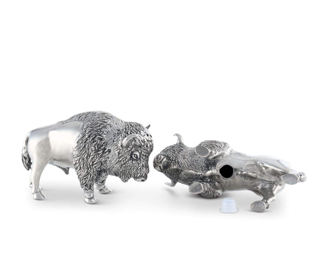 Silver buffalo and skull salt and pepper shakers on a white background