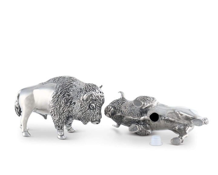 Silver buffalo and skull salt and pepper shakers on a white background