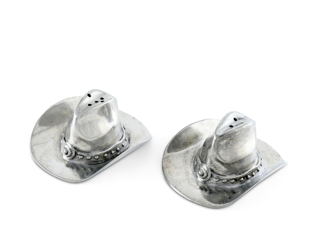 Silver cowboy hat-shaped salt and pepper shakers on a white background