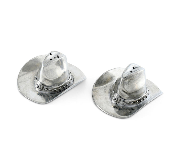 Silver cowboy hat-shaped salt and pepper shakers on a white background
