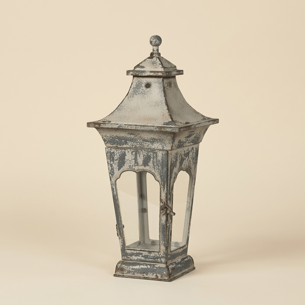 Small Vespera Iron Lantern with distressed finish on a warm cream studio background