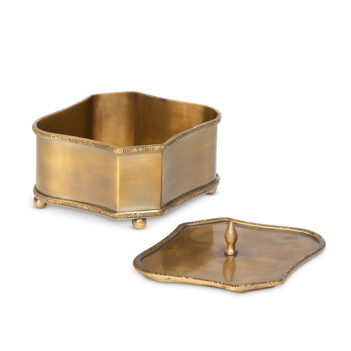 Vintage brass trinket box with lid, part of a set of three, featuring elegant decorative edging and ball feet for a classic look.
