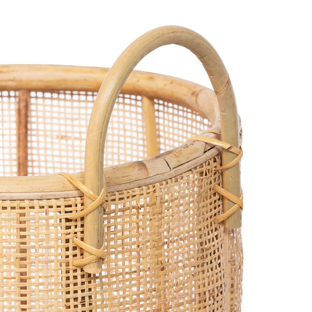 Close-up of Vintage Coastal Woven Rattan Basket with Handle showing cane weave detail.