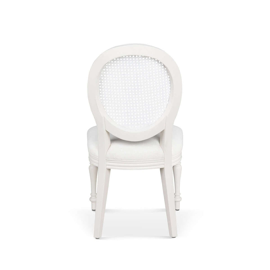 Rear view of Vintage Farmhouse Cane Back Dining Chair with white upholstery, showcasing elegant craftsmanship inspired by Cotswold design.
