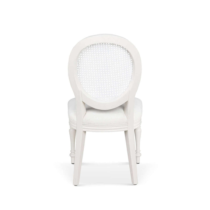 Rear view of Vintage Farmhouse Cane Back Dining Chair with white upholstery, showcasing elegant craftsmanship inspired by Cotswold design.