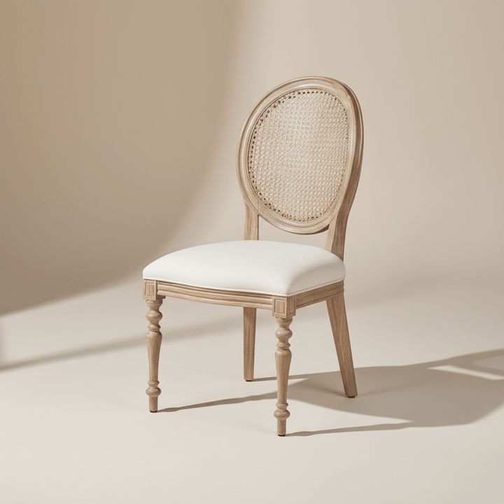 Vintage Farmhouse Cane Back Dining Chair in bright room with elegant design, linen upholstery, and hand-carved wood detailing.