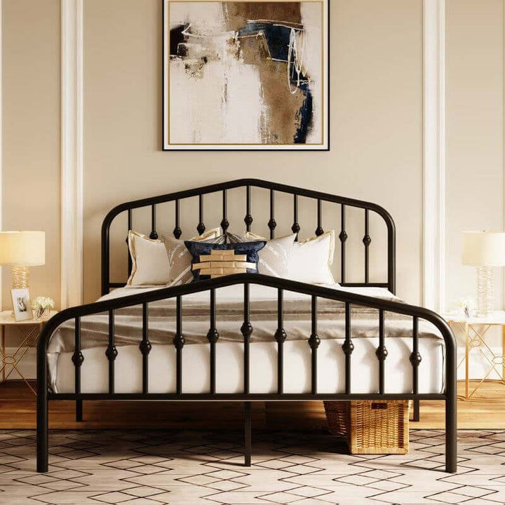 Vintage Farmhouse Spindle Black Metal Bed with arched headboard and footboard featuring classic spindle detailing in a cozy bedroom.