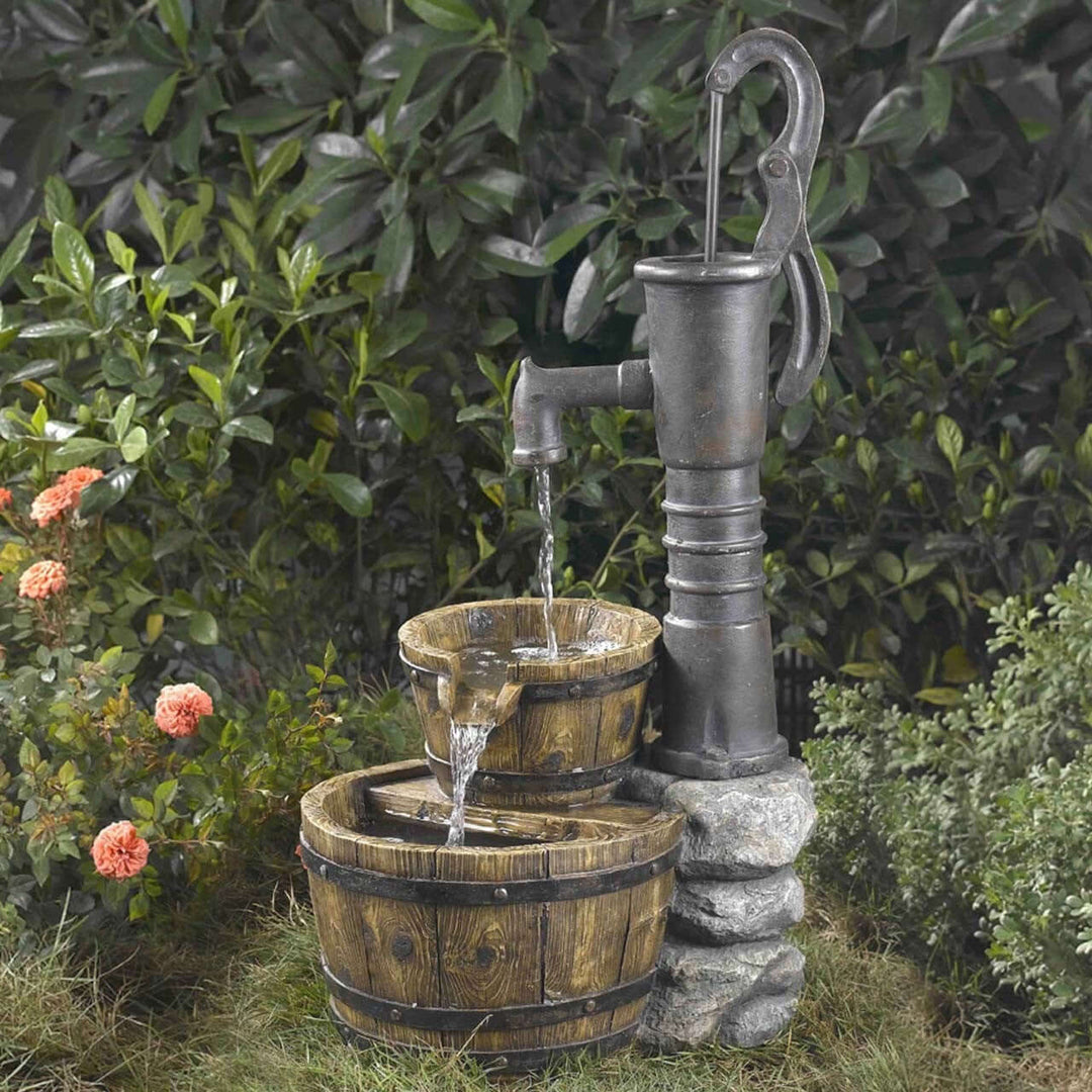 Vintage Farmhouse Water Pump Barrel Fountain in garden setting