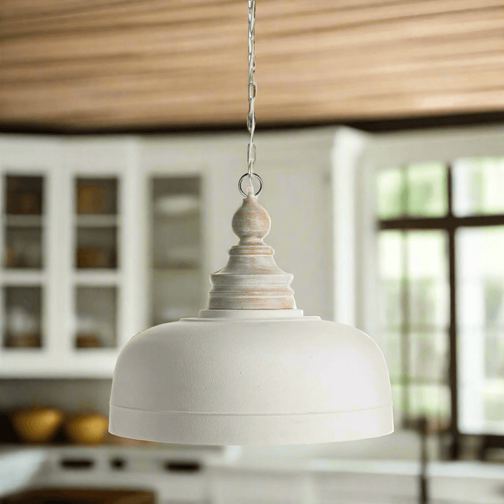Vintage farmhouse white dome pendant light with wood finial, adding elegance to a classic kitchen decor.