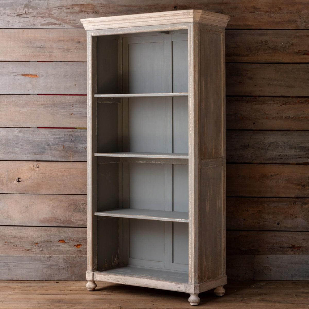 Vintage French Country Painted Wood Cabinet with distressed finish and open shelves against rustic wood panel background.