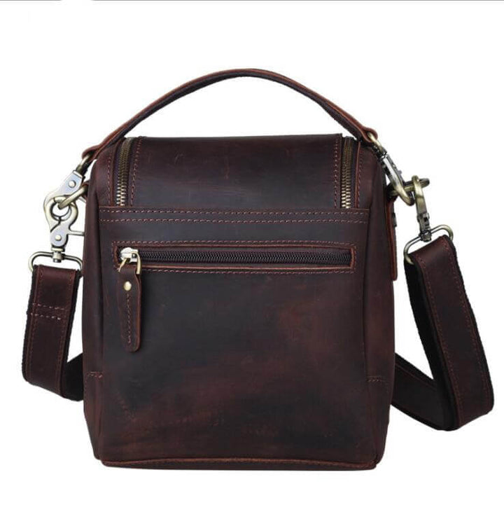 Vintage Full-Grain Leather Camera Bag with adjustable strap and zippered pocket, crafted with artistry, ideal for photographers and travelers.