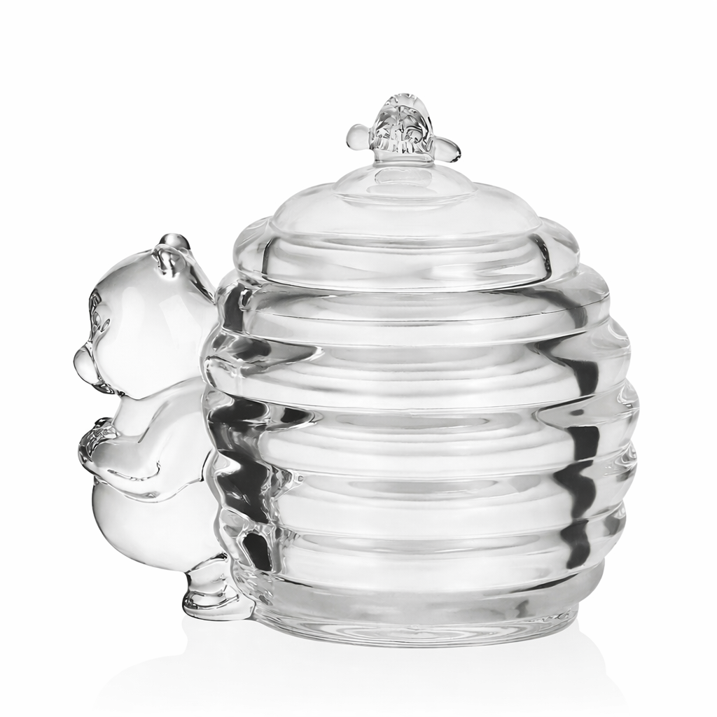 Vintage-inspired glass bear honey jar photographed against a light background