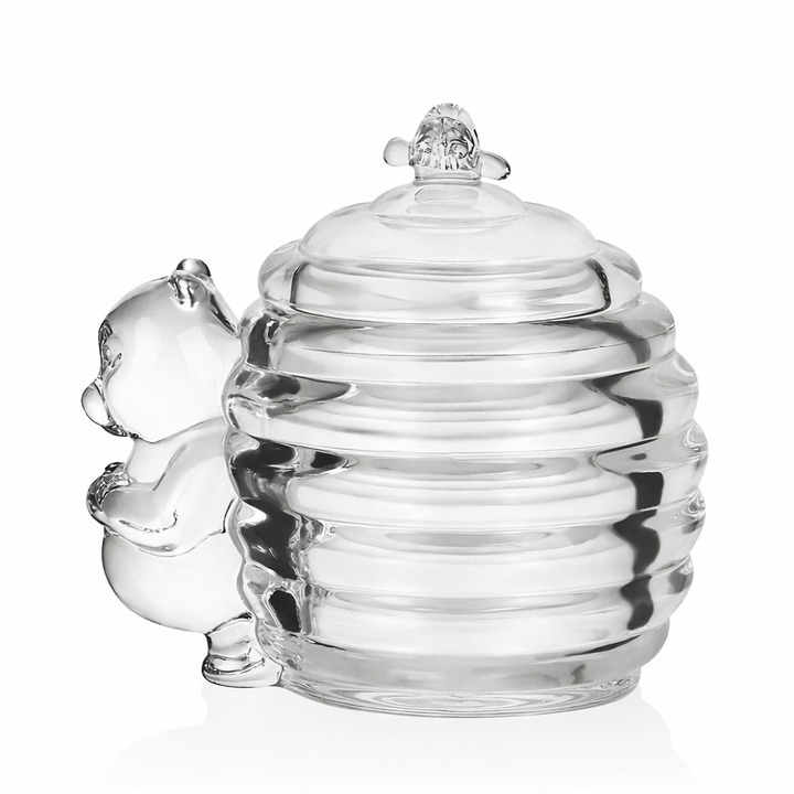 Vintage-inspired glass bear honey jar photographed against a light background