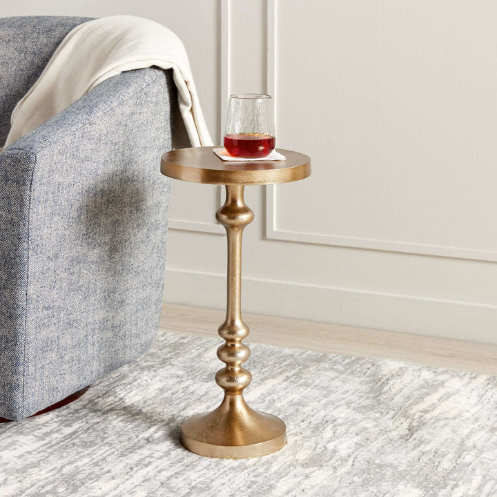 Vintage gold accent table with pedestal base, perfect for small spaces and adding elegance to your home decor.